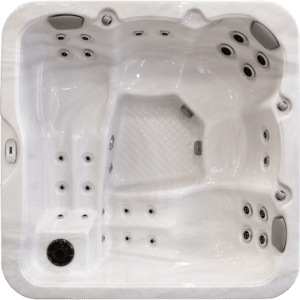Top-down view of a white rectangular hot tub with multiple built-in jets and seating for several people