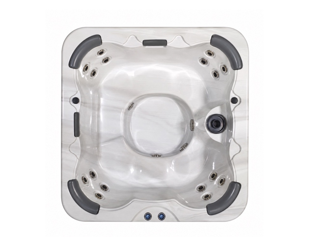 Top-down view of a white square hot tub with built-in seating and multiple jets, empty and ready for use.