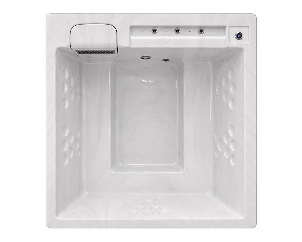 Top-down view of a white square hot tub interior with side jets and a control panel in the corner edge.