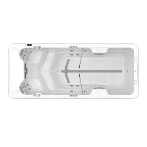 Top-down view of a white rectangular hot tub interior with seating and multiple jets along the sides and a central drain area.