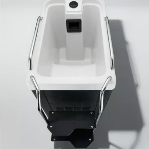 Top-down view of a white dental chair with chrome armrests and a control panel at the head area.