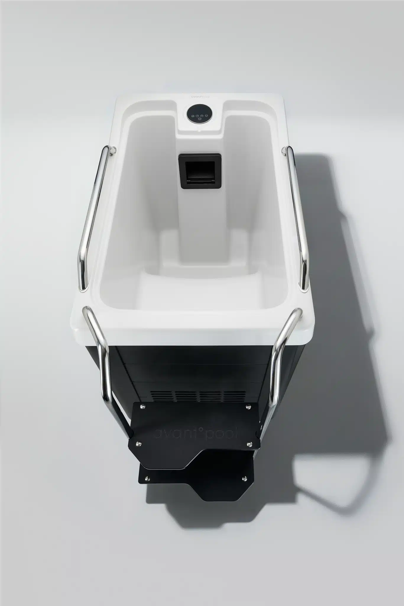 kinosevo-b-top-view-0426jpg » Auraspa Top-down view of a white dental chair with chrome armrests and a control panel at the head area.